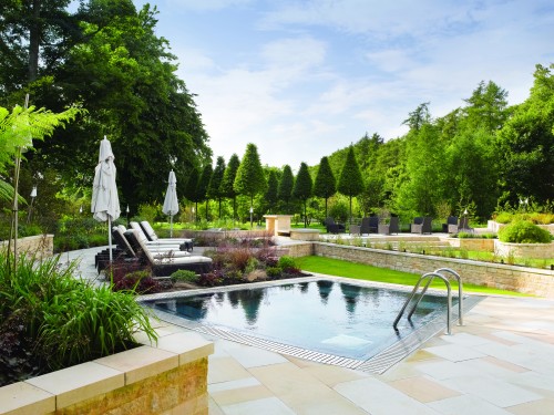 The outdoor pool and relaxing area at the spa at Lucknam Park