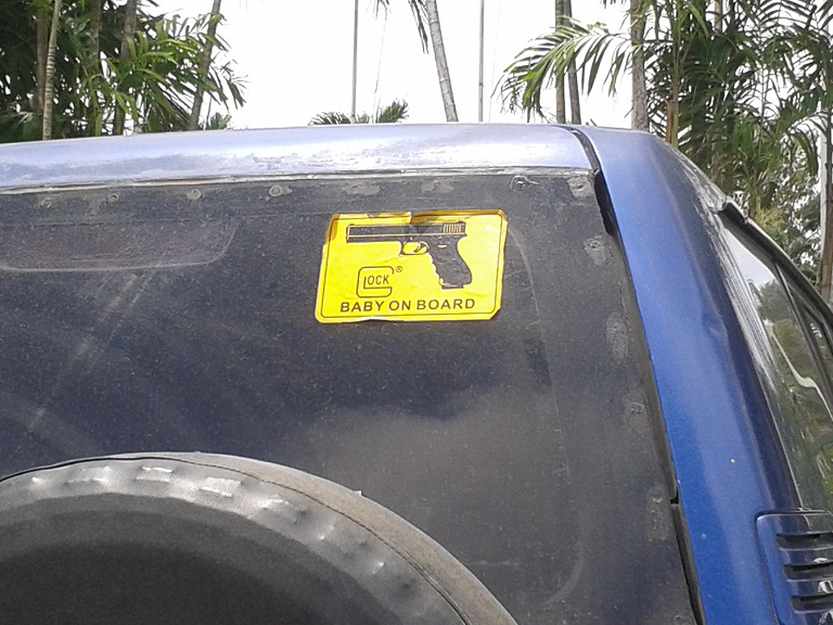 gun sign on a car in Papua New Guinea
