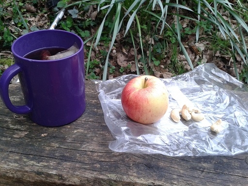 herbal tea, an apple and five nuts