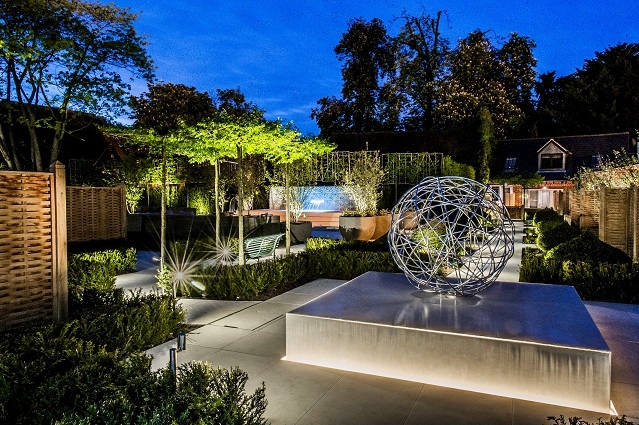 The Mews Suites courtyard at night 