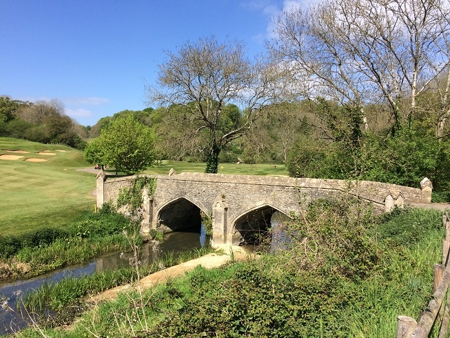 the manor house castle combe bridge over bybrook rvier