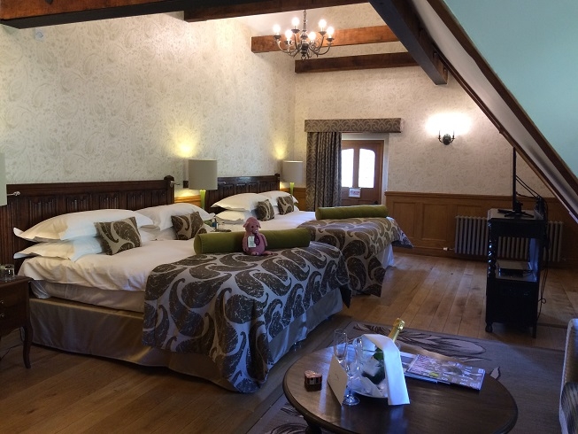 double bedroom at manor house castle combe