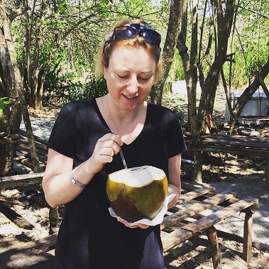 Drinking fresh coconut juice straight from the shell