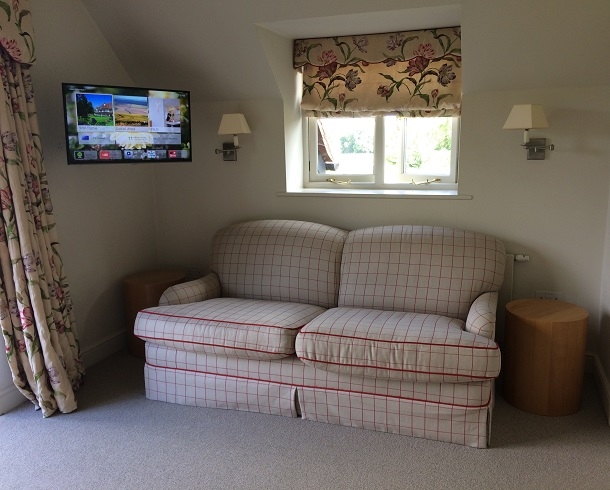 sofa and televisions at park house hotel west sussex
