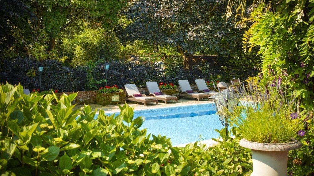 Chewton Glen loungers beautiful hotels with pools for the summer