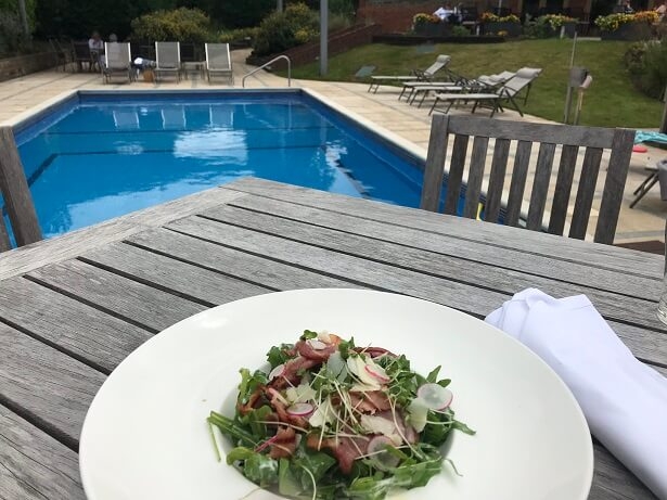 Caesar salad by the outdoor pool