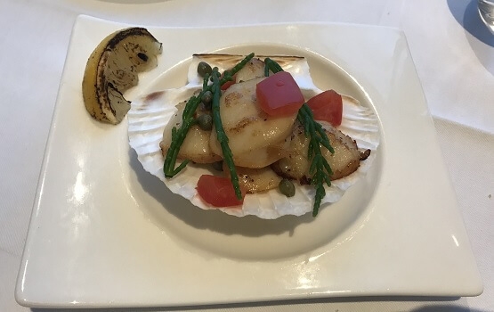 hand-dived Start Bay scallops with samphire and lemon, served in a scallop shell