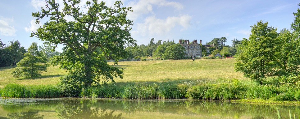 view from lake at Gravetye Manor hotel