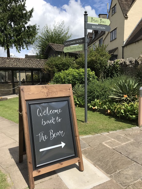 welcome sign at the bear of rodborough