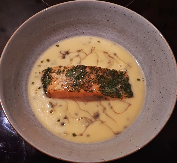 dill-topped trout served with rich butter sauce and capers, lemon and cornichons from northcote's restaurant meal kit