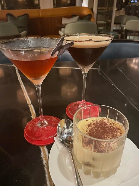 an espresso martini, a Manhattan and a serving of tiramisu