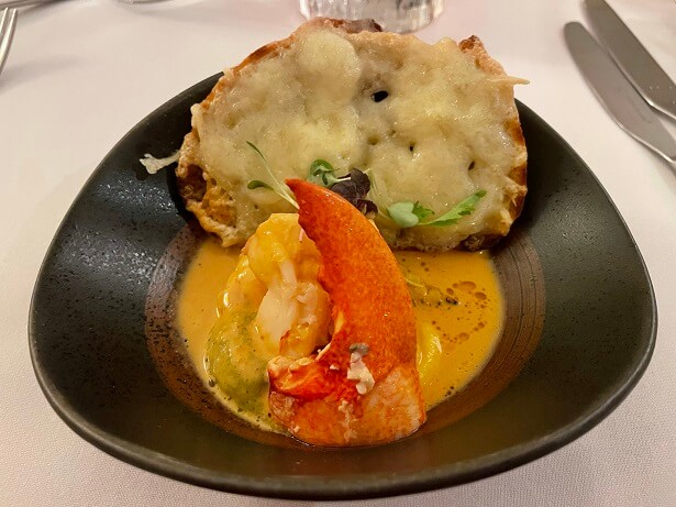 starter of poached lobster with gruyere on toast