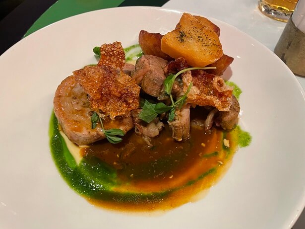 Roast porchetta with roast potatoes and rosemary jus at nhow London