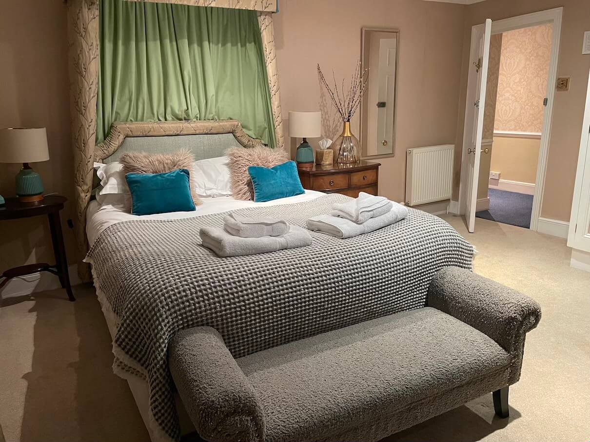 bedroom with double bed at Burleigh Court hotel Stroud