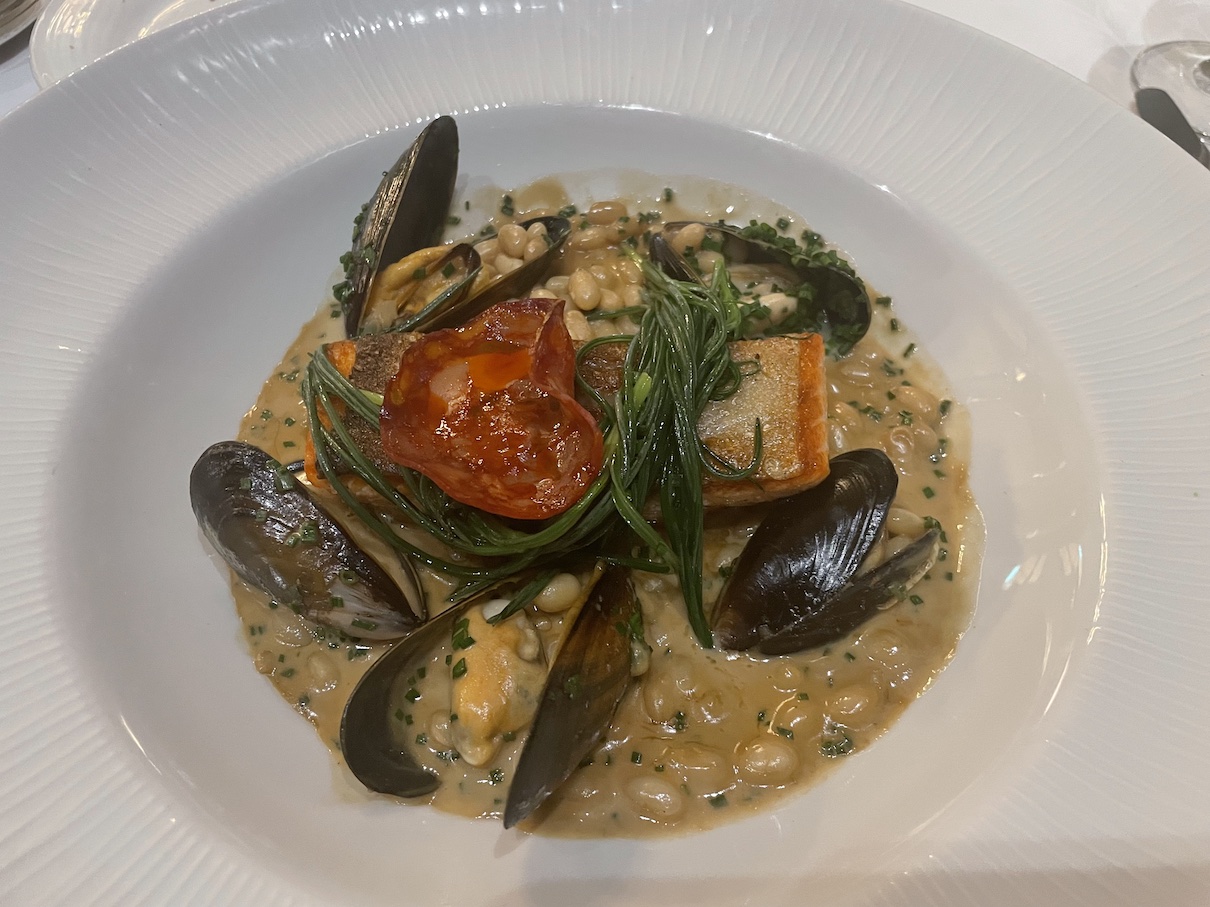 pan-fried trout with haricot bean fricassee, mussels, chorizo and shellfish sauce
