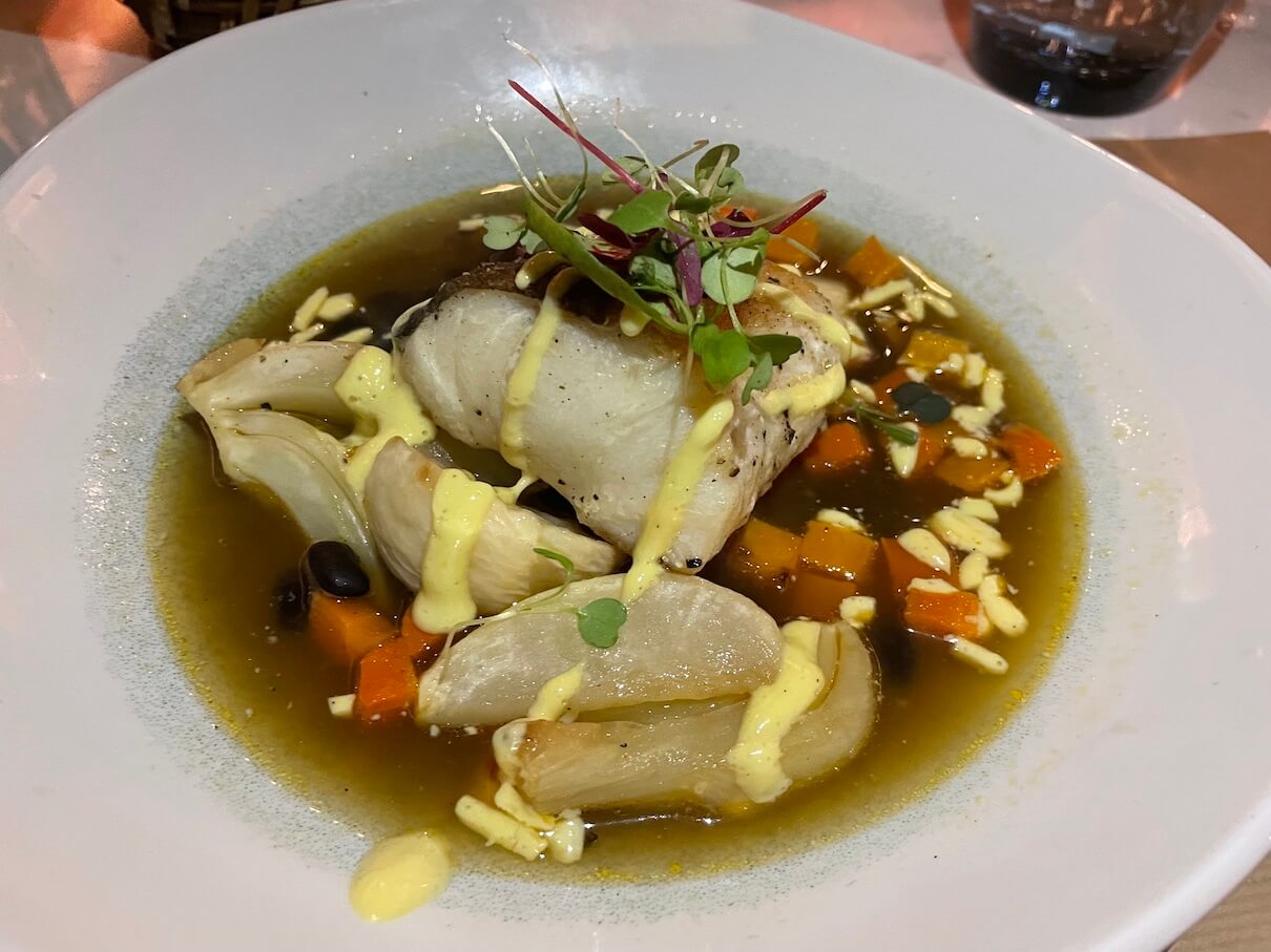 My hake fillet, with root vegetable broth and black turtle beans