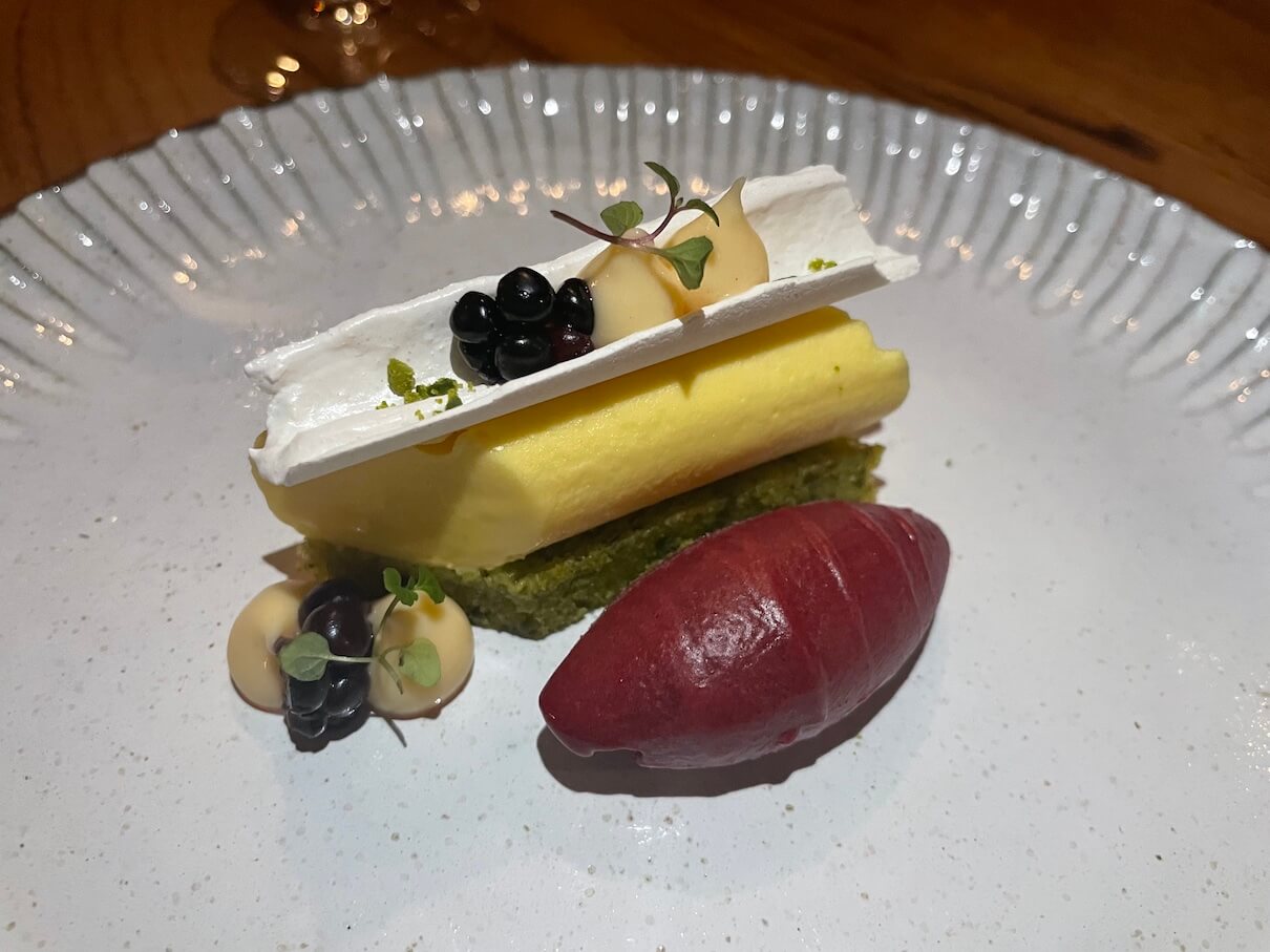 Saffron and lemon mousse with pistachio cake, cassis sorbet and cardamom meringue