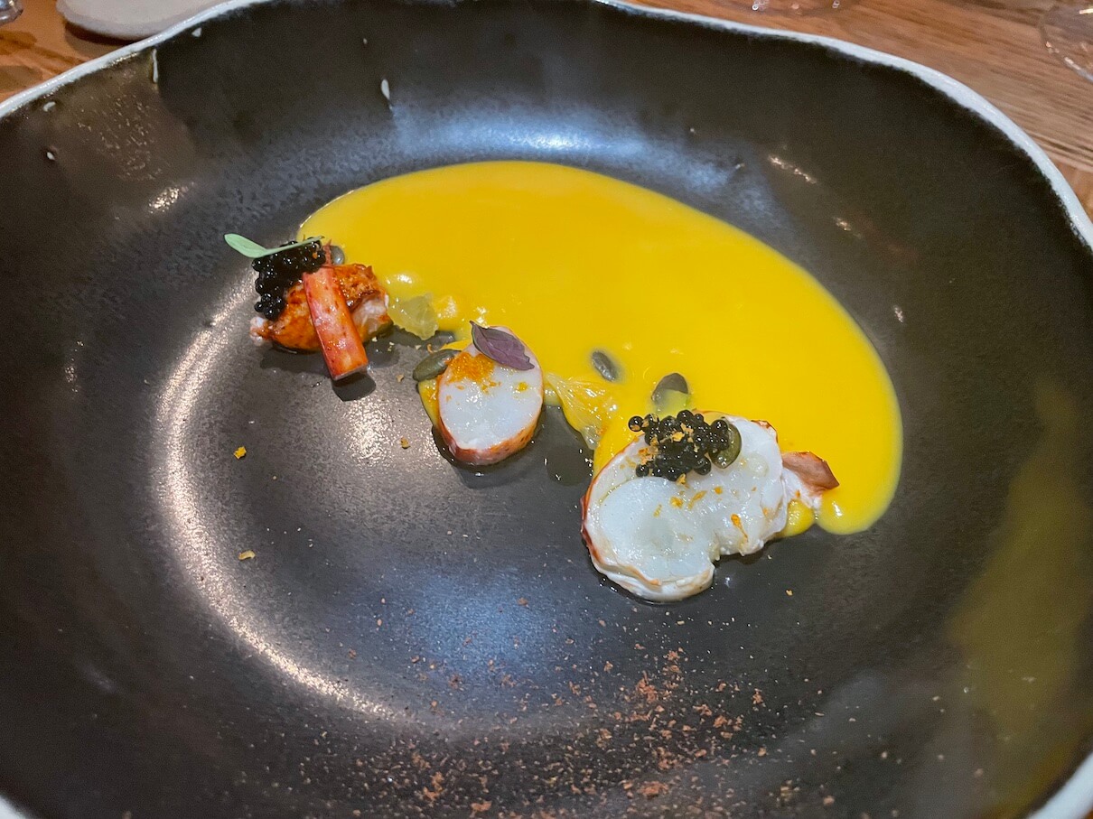 Felixstowe lobster, with butternut squash soup, orange, star anise and ink caviar