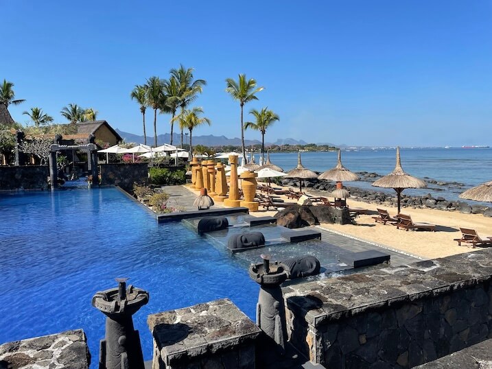 outdoor swimming pool and ocean at the Oberoi Beach Resort in Mauritius swimming pool