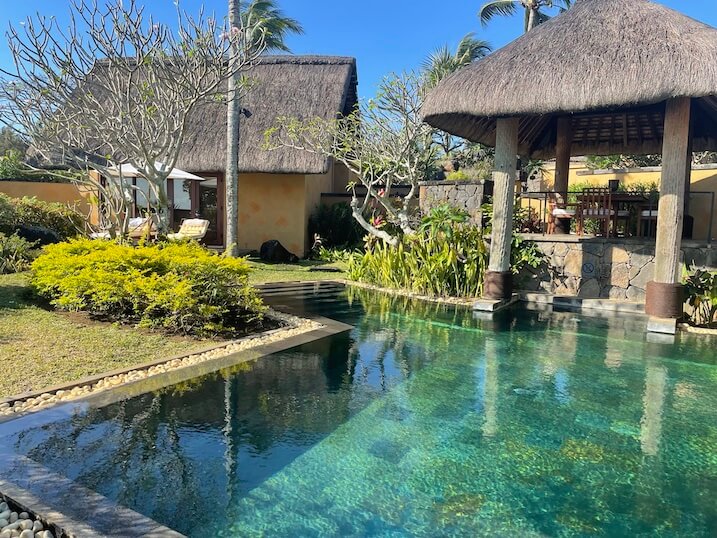 heated swimming pool and thatched open-air dining pavilion