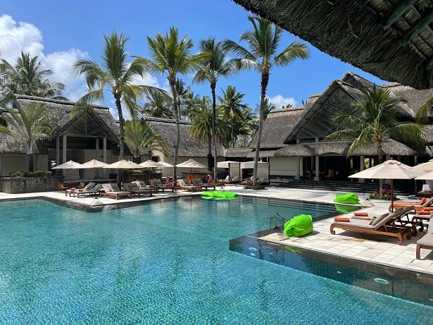 Constance Prince Maurice resort swimming pool and palm trees