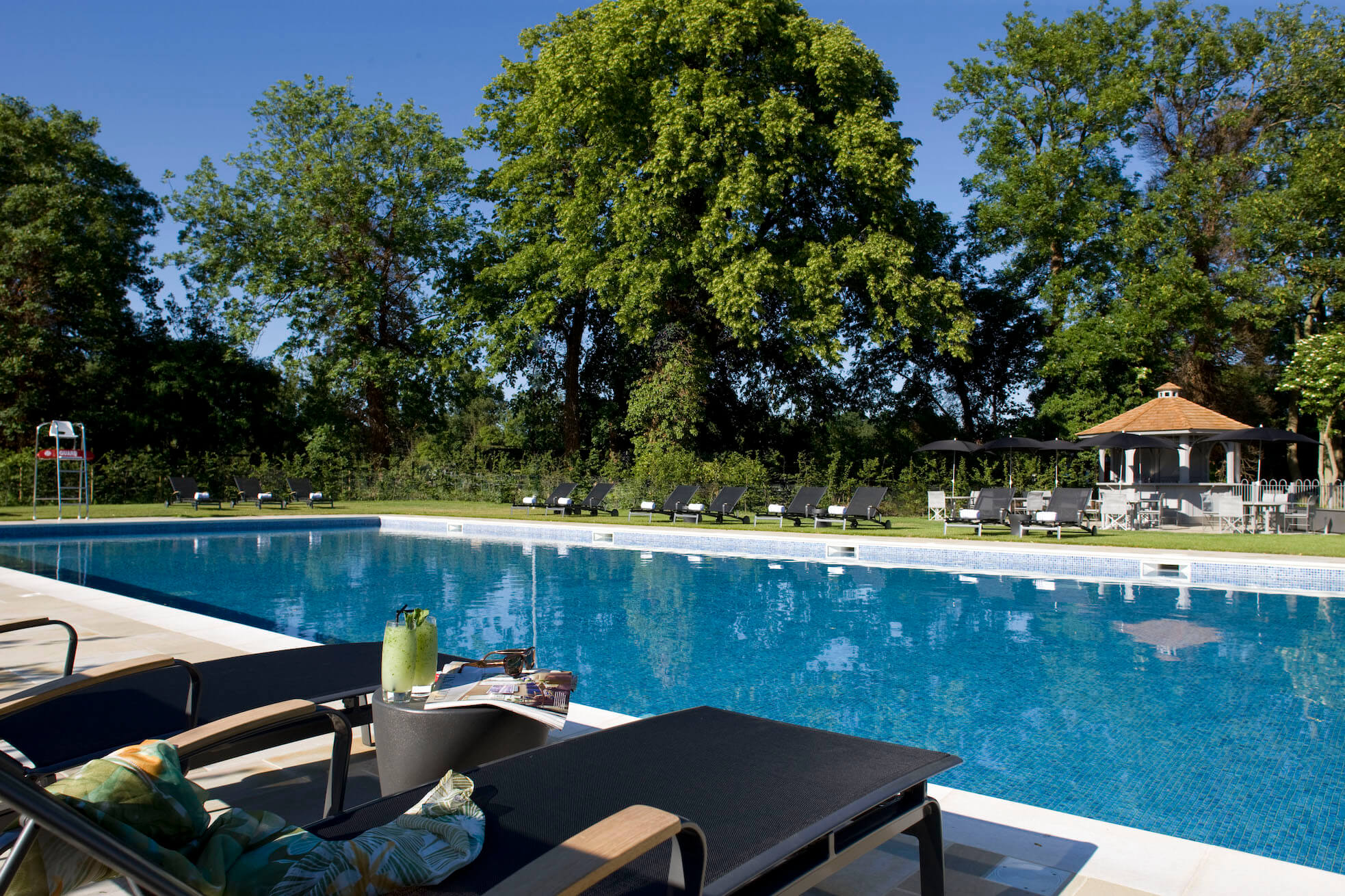 The heated outdoor pool at The Runnymede on Thames hotel and spa