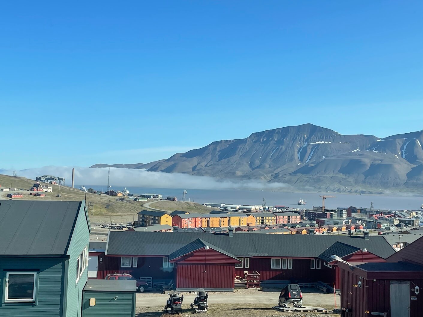 low-lying fog in the fjord by Longyearbyen