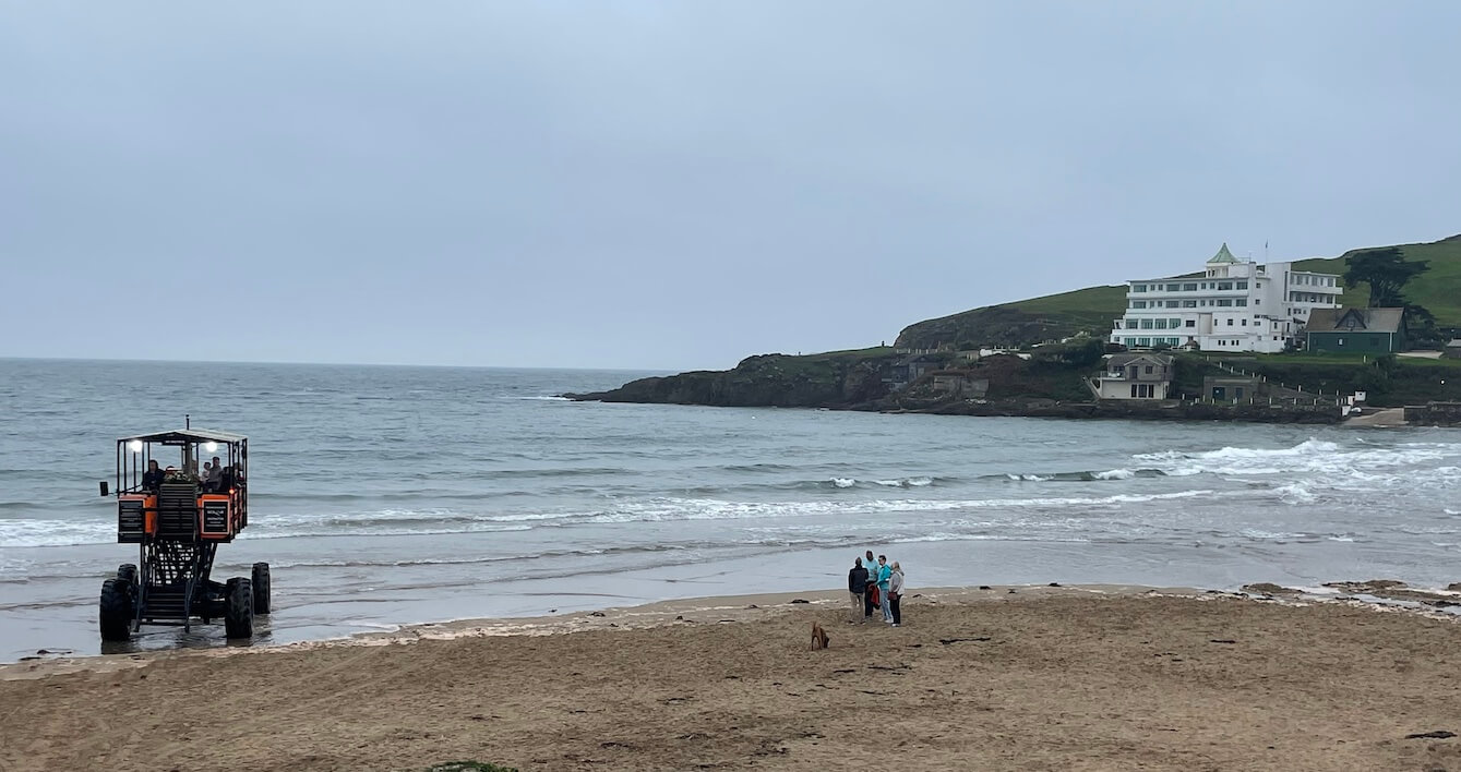 Visitors watching the sea tractor travel back and forth to the hotel on Burgh Island