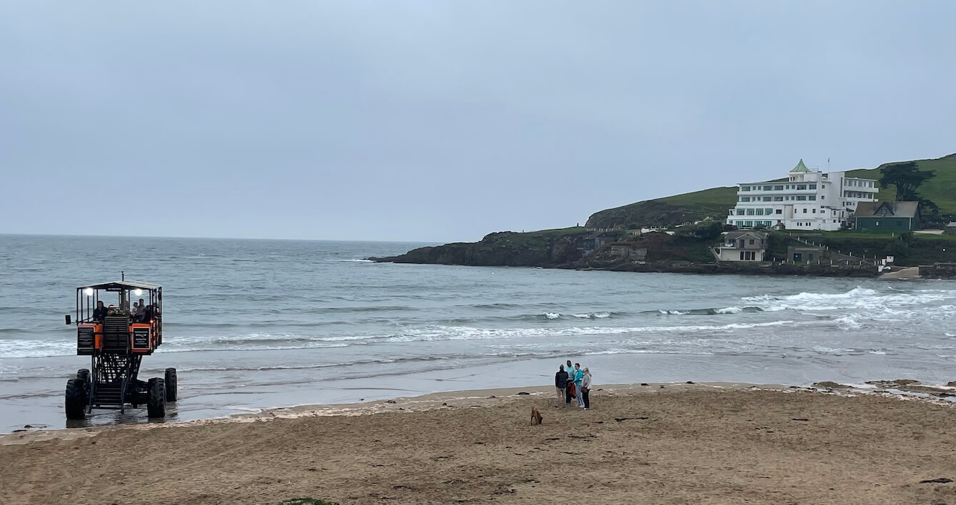 Visitors watching the sea tractor travel back and forth to the hotel on Burgh Island Visitors watching the sea tractor travel back and forth to the hotel on Burgh Island