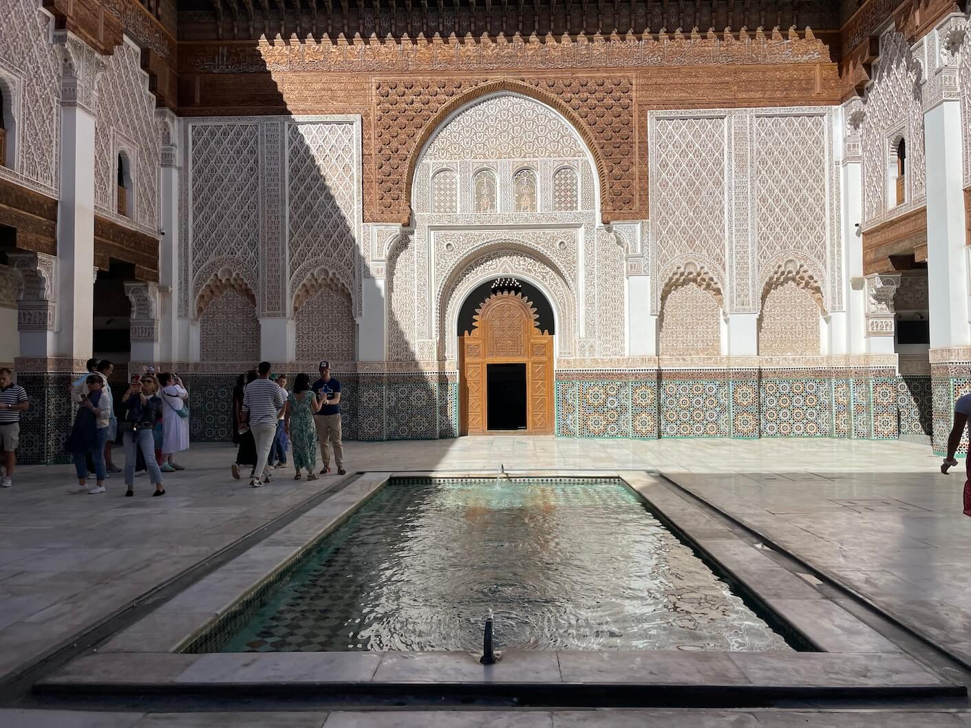 The central courtyard of Ben Yousseff Medersa, the historic Islamic school located in the heart of Marrakech